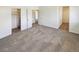 Large bedroom with neutral carpet and a large closet at 16750 E Ada Pl, Aurora, CO 80017