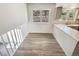 Open-concept kitchen featuring bright windows, quartz countertops, and stainless steel sink at 16750 E Ada Pl, Aurora, CO 80017