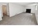 Spacious living room with neutral walls and a fireplace at 16750 E Ada Pl, Aurora, CO 80017