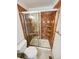 Bathroom featuring an enclosed shower and neutral color tiles at 16750 E Ada Pl, Aurora, CO 80017