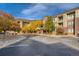 Attractive building exterior with fall foliage and accessible parking, showcasing a well-maintained facade at 2896 W Riverwalk Cir # A102, Littleton, CO 80123