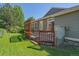 Landscaped backyard featuring a paver patio, privacy screen, and lush green lawn at 6673 S Benton St, Littleton, CO 80123