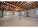 Unfinished basement offering high ceilings, natural light, and a blank canvas for customization at 6673 S Benton St, Littleton, CO 80123