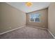 Cozy bedroom with neutral tones, ample natural light, and plush carpeting at 6673 S Benton St, Littleton, CO 80123