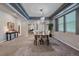 Open-concept dining room with decorative lighting, great for entertaining and gatherings at 6673 S Benton St, Littleton, CO 80123
