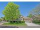 Charming single Gathering home with stone accents, a well-manicured lawn, and mature trees at 6673 S Benton St, Littleton, CO 80123