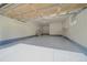 Spacious garage with sealed flooring, overhead door, and ample room for multiple vehicles at 6673 S Benton St, Littleton, CO 80123