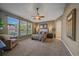 Spacious primary bedroom with large windows, ensuite bathroom, and walk-in closet at 6673 S Benton St, Littleton, CO 80123
