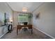 Inviting home office with a desk, chair, carpet, and a view of nature at 6673 S Benton St, Littleton, CO 80123