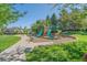 Community playground with slides, benches, and a path for Gathering enjoyment at 6673 S Benton St, Littleton, CO 80123
