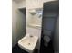 Small basement bathroom with toilet and sink at 153 S Pierce St, Lakewood, CO 80226