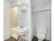 Small basement bathroom with toilet and sink at 153 S Pierce St, Lakewood, CO 80226