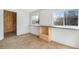 Unfinished basement area with natural light and built in counter with storage at 153 S Pierce St, Lakewood, CO 80226