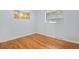 Simple bedroom with hardwood floors and ample natural light at 153 S Pierce St, Lakewood, CO 80226