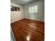 Spacious bedroom with hardwood floors and large window at 153 S Pierce St, Lakewood, CO 80226