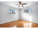 Spacious bedroom featuring hardwood floors and ceiling fan at 153 S Pierce St, Lakewood, CO 80226