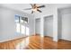 Well-lit bedroom with hardwood floors and double closets at 153 S Pierce St, Lakewood, CO 80226