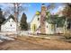 Yellow cottage, white barn, and snowy landscape at 153 S Pierce St, Lakewood, CO 80226