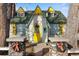 Charming home with gabled roof, colorful trim, and a welcoming yellow door at 153 S Pierce St, Lakewood, CO 80226