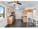 Bright kitchen with stainless steel appliances and light wood cabinets at 153 S Pierce St, Lakewood, CO 80226