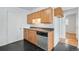 Kitchen features stainless steel dishwasher and wood cabinets at 153 S Pierce St, Lakewood, CO 80226