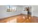 Hardwood floor living room with kitchen view at 153 S Pierce St, Lakewood, CO 80226