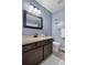 Updated bathroom with new vanity, fixtures, and tile flooring at 4301 S Pierce St # 6D, Littleton, CO 80123
