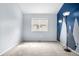 Bright bedroom with a window and neutral carpet perfect for personalization at 4301 S Pierce St # 6D, Littleton, CO 80123