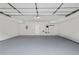 This garage has an epoxy floor, white walls, and ample space at 4301 S Pierce St # 6D, Littleton, CO 80123