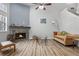 Cozy living room with a stone fireplace, vaulted ceilings, and lots of natural light at 4301 S Pierce St # 6D, Littleton, CO 80123