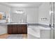 The bathroom showcases a double vanity, tub, and separate shower at 4301 S Pierce St # 6D, Littleton, CO 80123