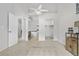 Spacious primary bedroom showing an open layout with walk-in closet and ensuite bath at 4301 S Pierce St # 6D, Littleton, CO 80123