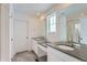 Bathroom with double vanity, dark countertop and a walk-in shower at 210 Paloma Way, Elizabeth, CO 80107