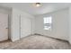 Bedroom with neutral carpeting, double door closet and a window at 210 Paloma Way, Elizabeth, CO 80107