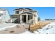 Two-story house with light-colored siding, a two-car garage, and a wooden fence at 210 Paloma Way, Elizabeth, CO 80107