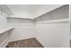 Bright walk-in closet with double hanging rods and shelving at 210 Paloma Way, Elizabeth, CO 80107