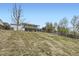 View of home's expansive yard and upper level deck at 1146 Croke Dr, Thornton, CO 80260