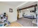 A finished basement offering a cozy bed and storage for personal items at 1146 Croke Dr, Thornton, CO 80260