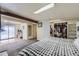 Basement boasts wood beams, a finished closet and a bed in the background at 1146 Croke Dr, Thornton, CO 80260