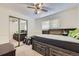 Comfortable bedroom boasts a large custom bed with drawers and a ceiling fan at 1146 Croke Dr, Thornton, CO 80260