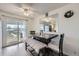 Bright dining area with sliding glass doors leading to outdoor balcony with lovely views at 1146 Croke Dr, Thornton, CO 80260