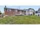 Charming brick home with well-maintained lawn and wheelchair ramp at 1146 Croke Dr, Thornton, CO 80260