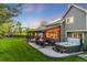 Outdoor space featuring a covered patio, seating area, fire pit, and a luxurious hot tub at 10188 Stephen Pl, Highlands Ranch, CO 80130