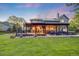 Gorgeous backyard with a covered deck, outdoor seating, a built-in grill, and a hot tub at 10188 Stephen Pl, Highlands Ranch, CO 80130