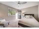Comfortable bedroom with a ceiling fan, plush carpet, and lots of natural light at 10188 Stephen Pl, Highlands Ranch, CO 80130