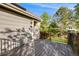 This deck features wooden railing and has a sliding glass door leading into the home at 10188 Stephen Pl, Highlands Ranch, CO 80130