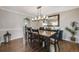 Formal dining room offers hardwood floors and a large mirror at 10188 Stephen Pl, Highlands Ranch, CO 80130