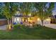 Inviting two-story home with mature landscaping and a well-maintained lawn at dusk at 10188 Stephen Pl, Highlands Ranch, CO 80130