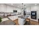 The updated kitchen has an island, stone countertops, white cabinets, and modern stainless steel appliances at 10188 Stephen Pl, Highlands Ranch, CO 80130
