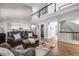 Open-concept living room with high ceilings and a loft area, perfect for relaxing at 10188 Stephen Pl, Highlands Ranch, CO 80130